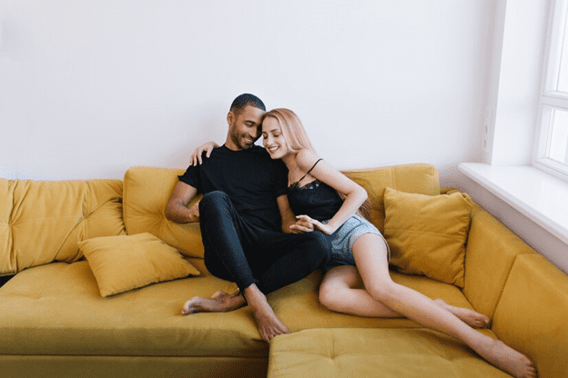 Couple Laying On Couch